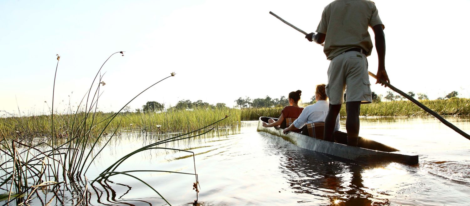 Canoe-Trip-with-traditional-mokoro-boat-on-the-river-through-Okavango-Delta